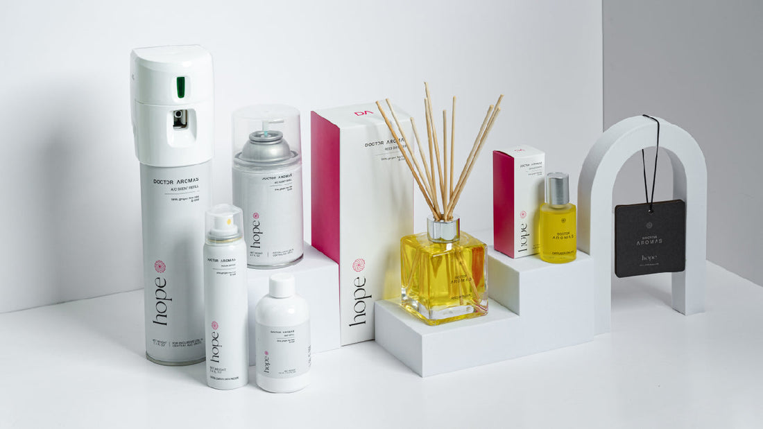 A collection of Doctor Aromas “Hope” scented products, including sprays, diffusers, oils, and an air freshener card, displayed on minimalist white platforms with modern packaging.