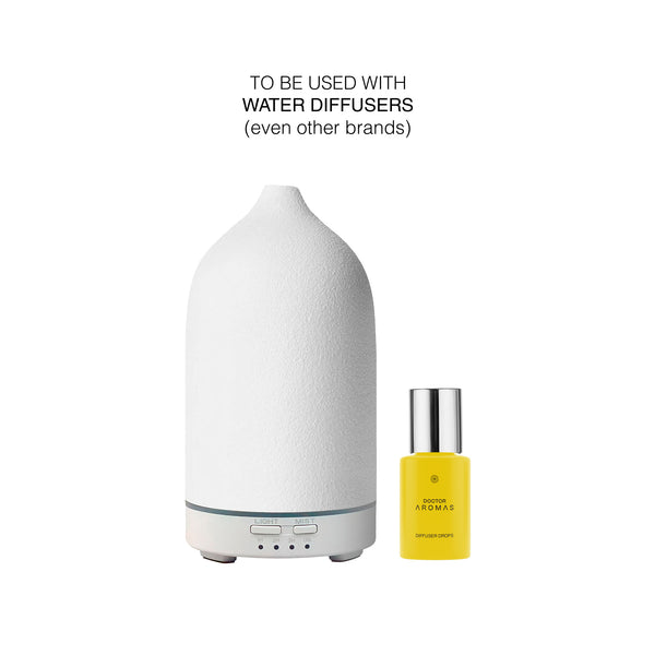 White ceramic ultrasonic diffuser with digital controls next to a small yellow bottle of Hope diffuser drops. - Diffuser Drops | Hope - Hope - Doctor Aromas
