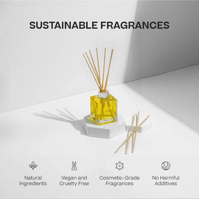 Yellow square glass oil reed diffuser with natural wooden reeds on white geometric pedestal under soft light. - Oil Reed Diffuser | Holiday - Holiday - Doctor Aromas