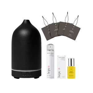 Black matte ceramic essential oil diffuser with four dark brown scent cards, white spray bottle, and small yellow roller. - The Gift of HOPE® Deluxe - White - Doctor Aromas