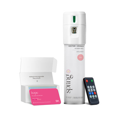 White A/C scenting spray can labeled Blush with small black remote and pink-scented refill card in open box. - A/C Scenting System | Blush - Blush - Doctor Aromas
