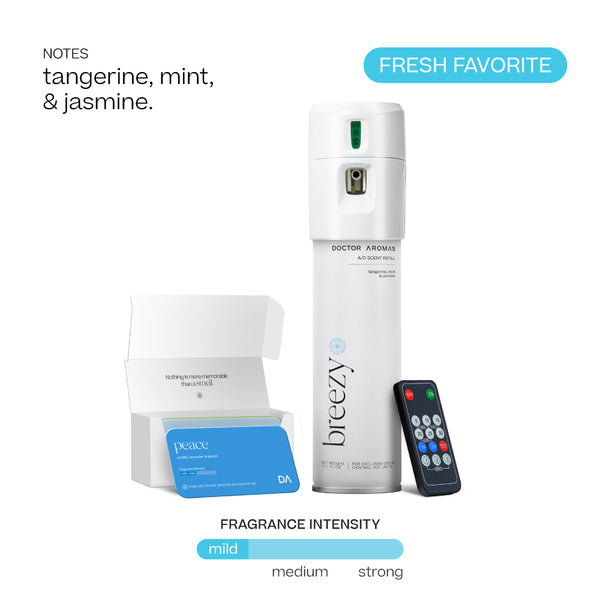 White cylindrical A/C scenting system with Breezy fragrance card, remote control, and fragrance intensity labeled mild. - Doctor Aromas A/C Scenting System - A/C Spray Dispenser with Remote Control, Customizable Scent Experience, Vegan & Cruelty-Free, 17.1 oz Fragrance Oil, Whole Home Freshener, Battery Operated, Non-Toxic, Cosmetic Grade Scents - Hope® - Doctor Aromas