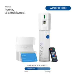 White cylindrical Doctor Aromas A/C scenting system with Winter fragrance label, remote control, and blue scent refill box. - Doctor Aromas A/C Scenting System - A/C Spray Dispenser with Remote Control, Customizable Scent Experience, Vegan & Cruelty-Free, 17.1 oz Fragrance Oil, Whole Home Freshener, Battery Operated, Non-Toxic, Cosmetic Grade Scents - Hope® - Doctor Aromas