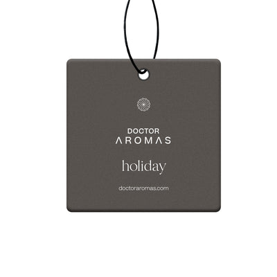 Square dark gray car air freshener with white "Doctor Aromas holiday" text hanging by black string. - Car Perfume | Holiday - Holiday - Doctor Aromas