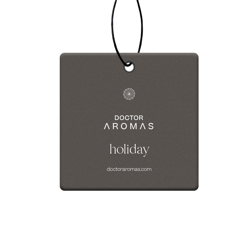 Square dark gray car air freshener with white "Doctor Aromas holiday" text hanging by black string. - Car Perfume | Holiday - Holiday - Doctor Aromas