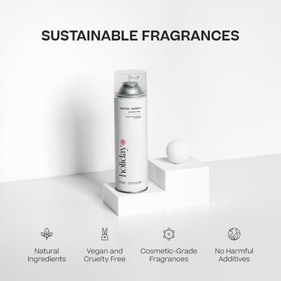 Tall silver aerosol can with white label reading Holiday, placed next to a white cube and sphere on a white surface. - A/C Scenting System | Holiday - Holiday - Doctor Aromas