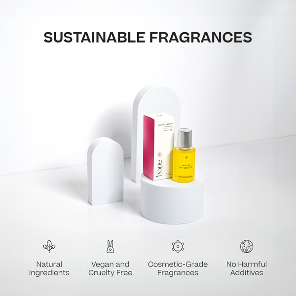 Yellow liquid diffuser oil bottle labeled Hope with white and pink box on white display pedestal. - Diffuser Drops | Hope - Hope - Doctor Aromas