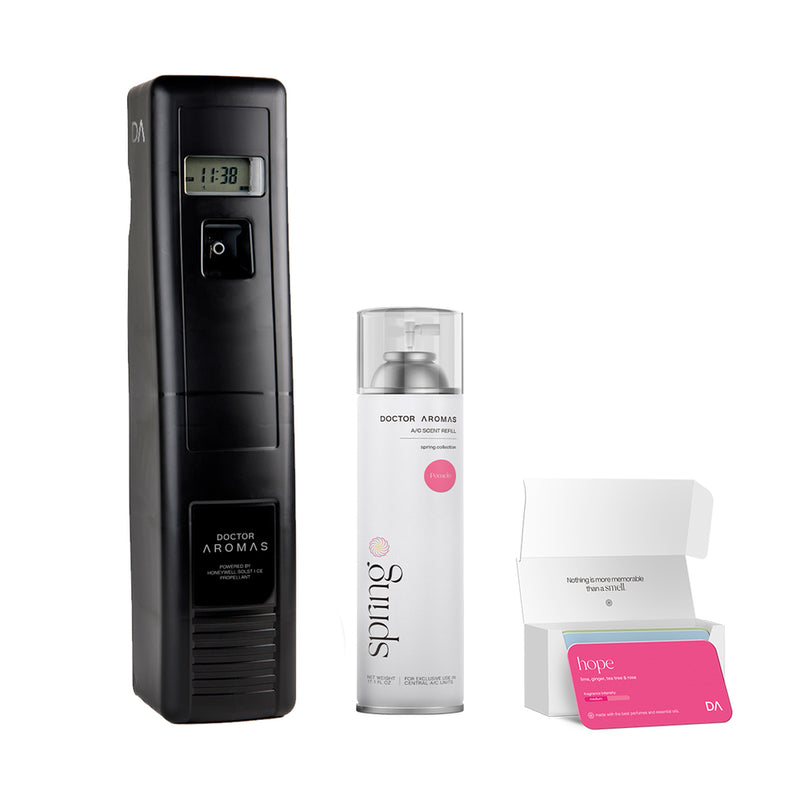 Black vertical A/C scenting device next to silver pomelo-scent spray can and open box with pink refill cartridge inside. - A/C Scenting System Pro | Pomelo - Pomelo - Doctor Aromas