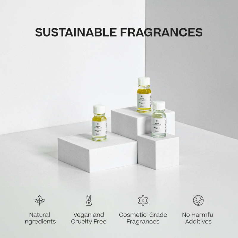Three small clear glass bottles of Portable Diffuser Refills with white labels and yellow accents on white geometric. - Portable Diffuser Refills Pack of Three | Signature Collection - Signature Collection - Doctor Aromas