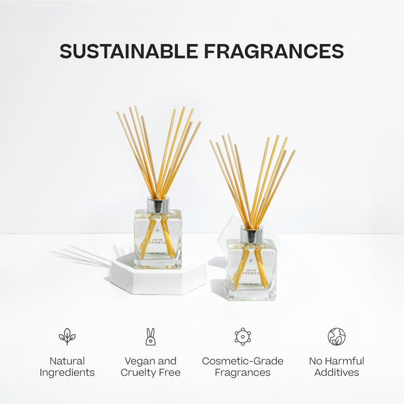 Two square glass oil reed diffusers with natural wooden sticks, labeled Holiday fragrance. - Oil Reed Diffuser Twin Pack | Holiday - Holiday - Doctor Aromas
